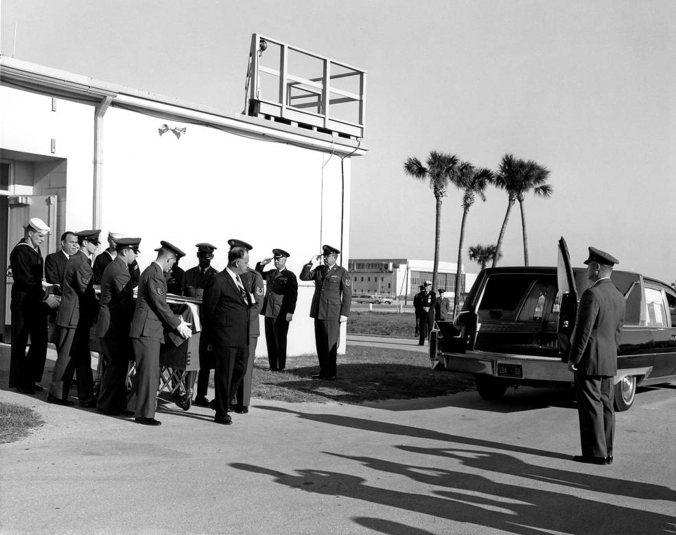 grissom_coffin_being_loaded_into_hearse_at_cape-1.30.67