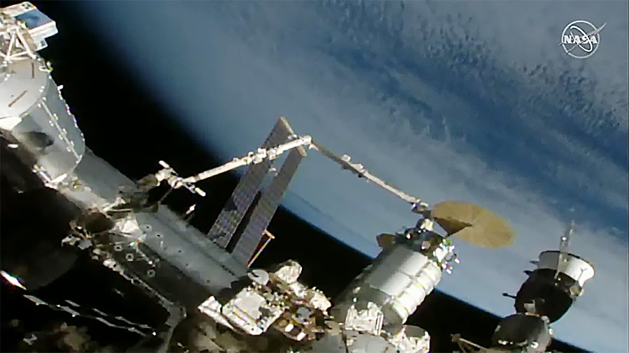 The Cygnus space freighter is positioned by the Canadarm2 robotic arm to be installed on the space station's Unity module.