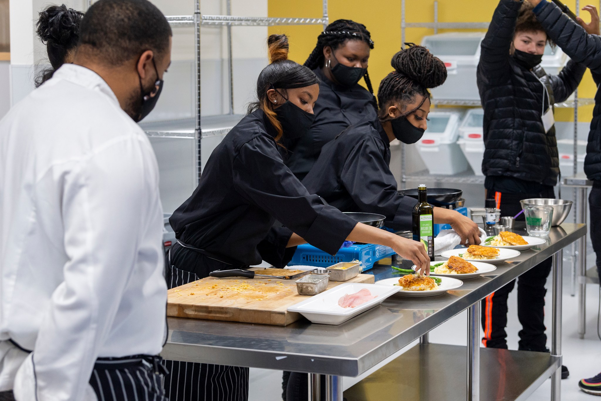 High school students prepared delicious meals for taste testers to try as part of NASA's Black History Month event focused on health and wellness. 