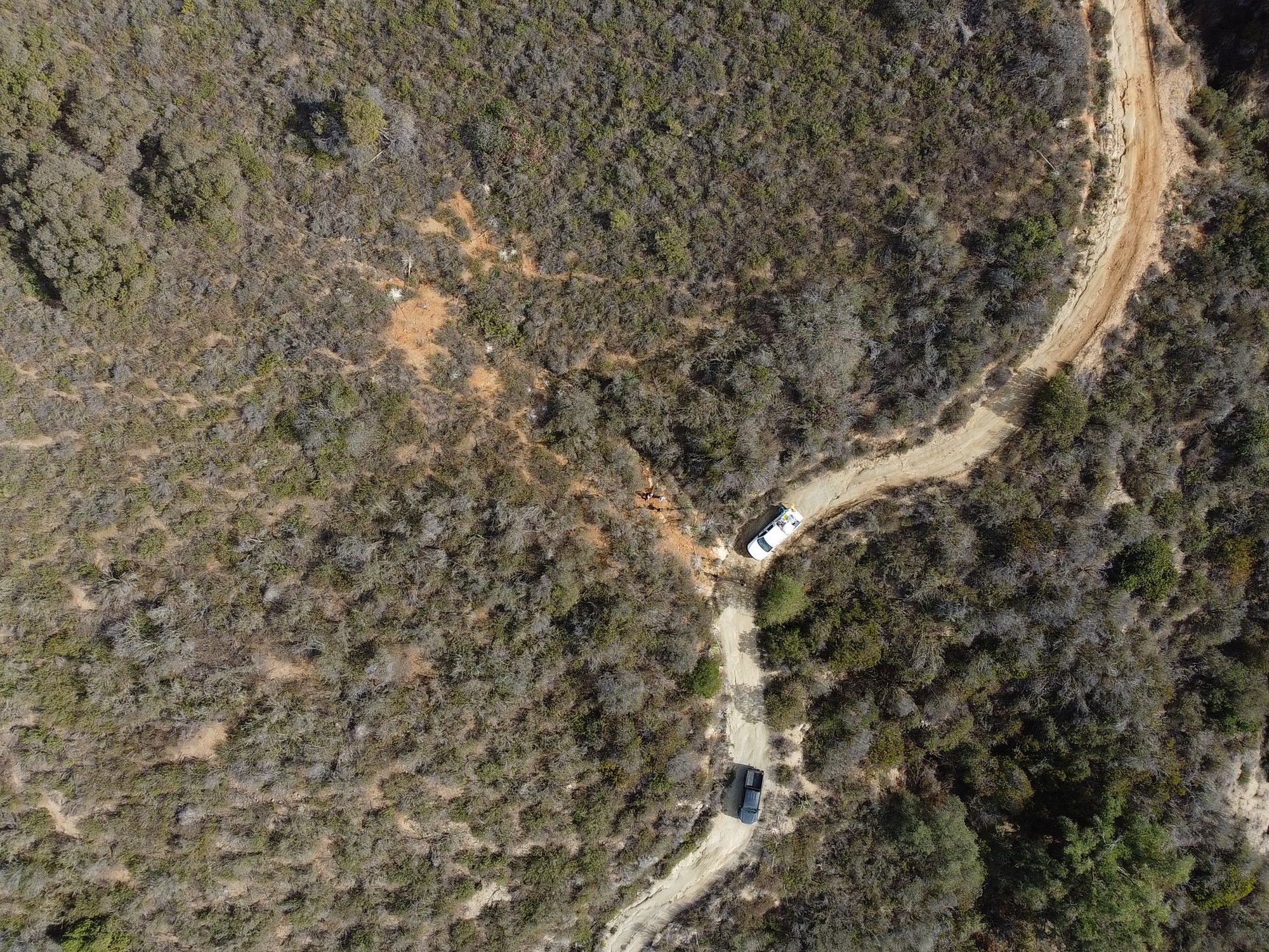 An aerial drone captured this view of members of NASA’s Perseverance Mars rover team in the Santa Margarita Ecological Reserve in Southern California as they searched for crumbly rocks for a test campaign.