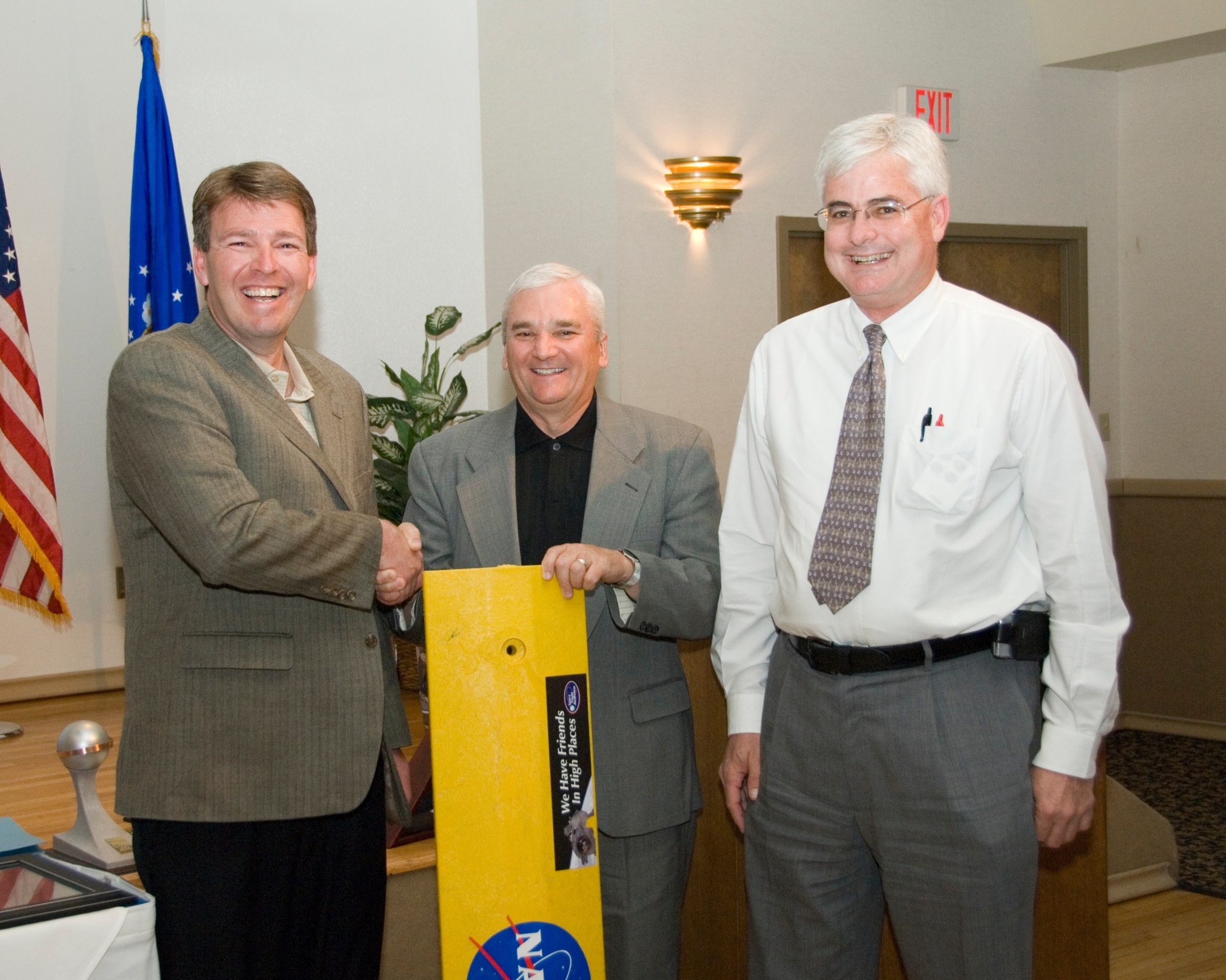 Pat Stoliker, NASA’s Armstrong Flight Research Center deputy director, right, was part of a joke on then retiring Kevin Petersen, center director. At left is Brad Flick, who has been selected as the new deputy center director.