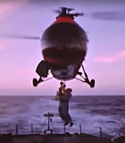 glenn_hoisted_aboard_helo_on_noa