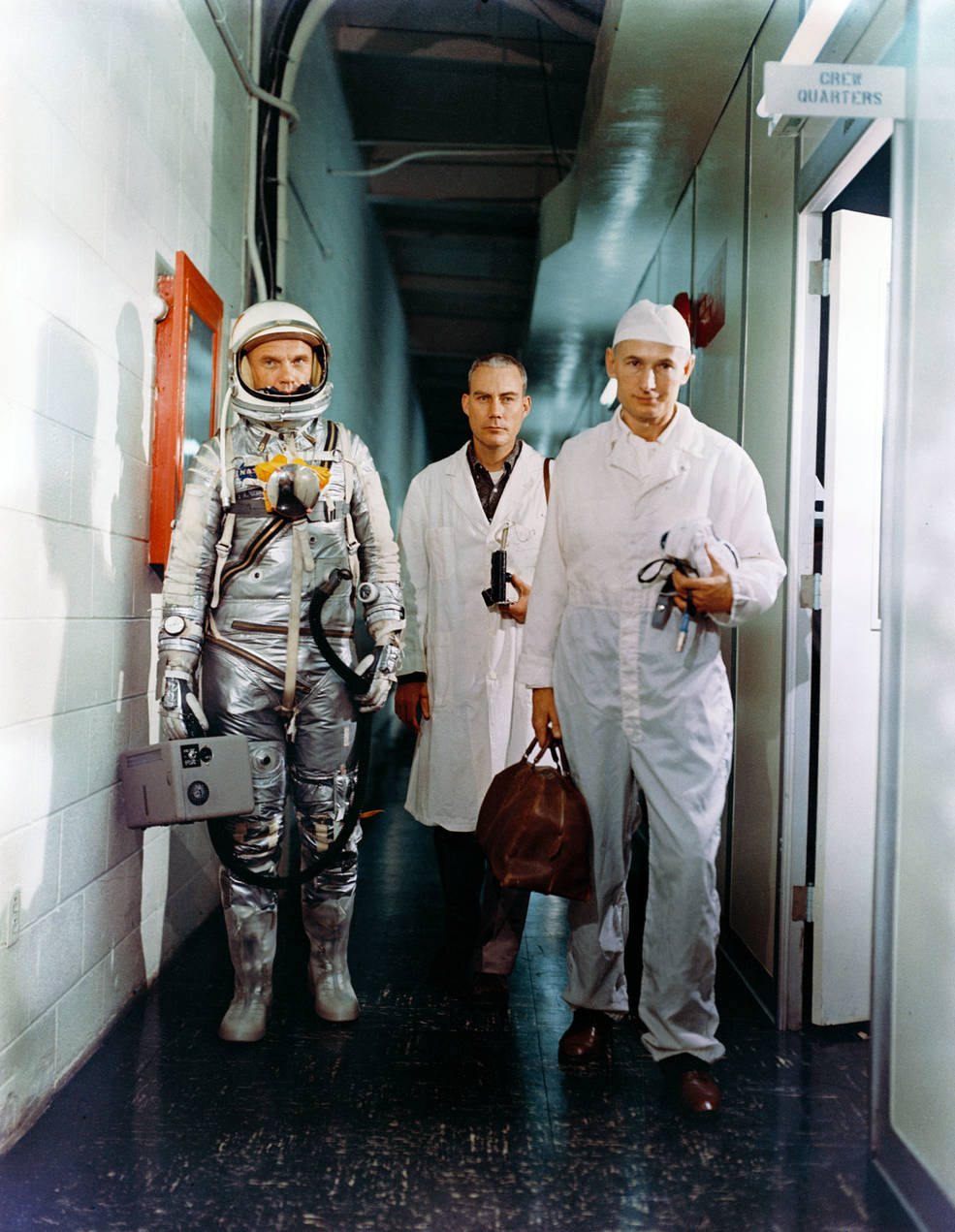 glenn_leaving_crew_quarters_w_surgeon_william_douglas_and_suit_tech_joe_schmitt_feb_20_1962