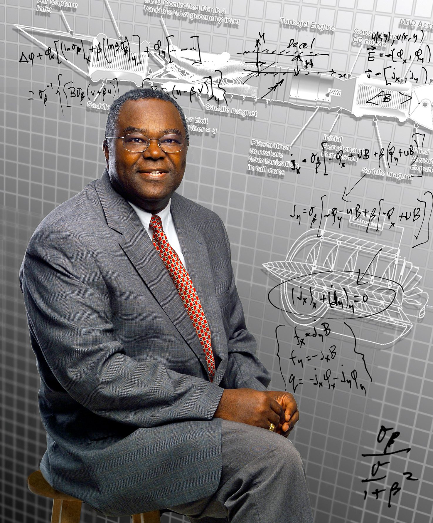 African American poses for portrait in front of scientific drawings.