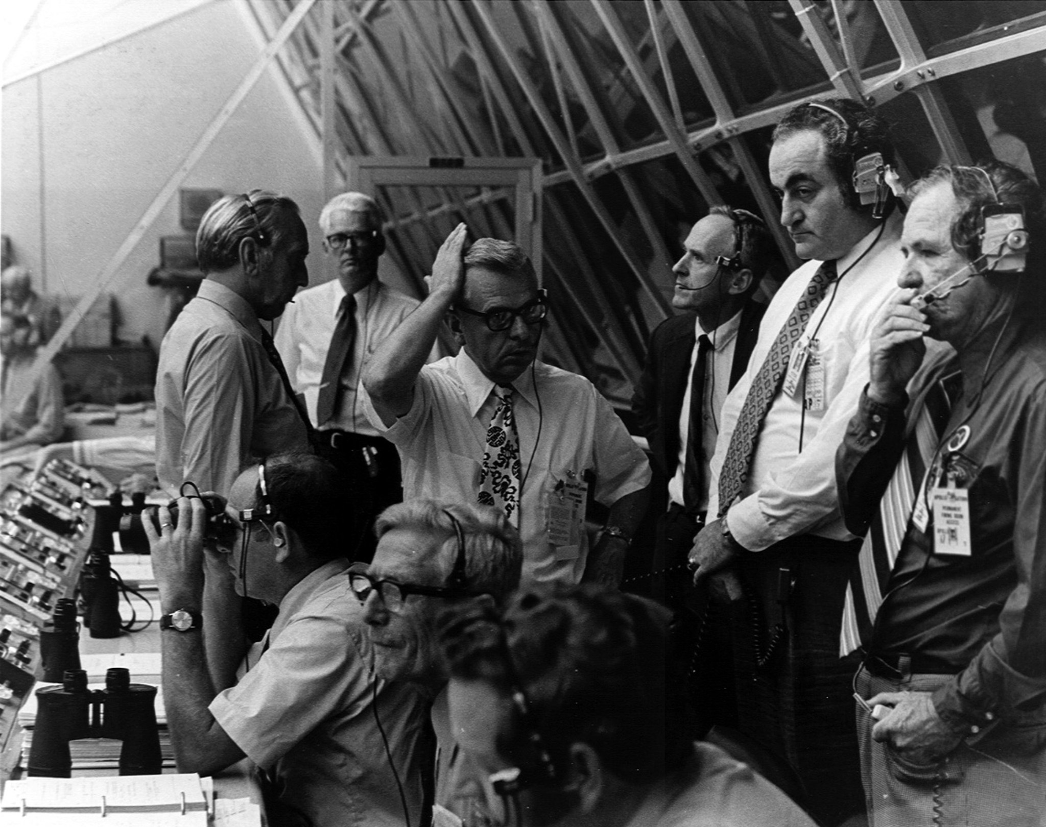 Standing at right, Isom A. “Ike”  Rigell, deputy director of Kennedy Space Center Launch Vehicle Operations, works with other NASA officials on Dec. 7, 1972, in the Launch Control Center.  