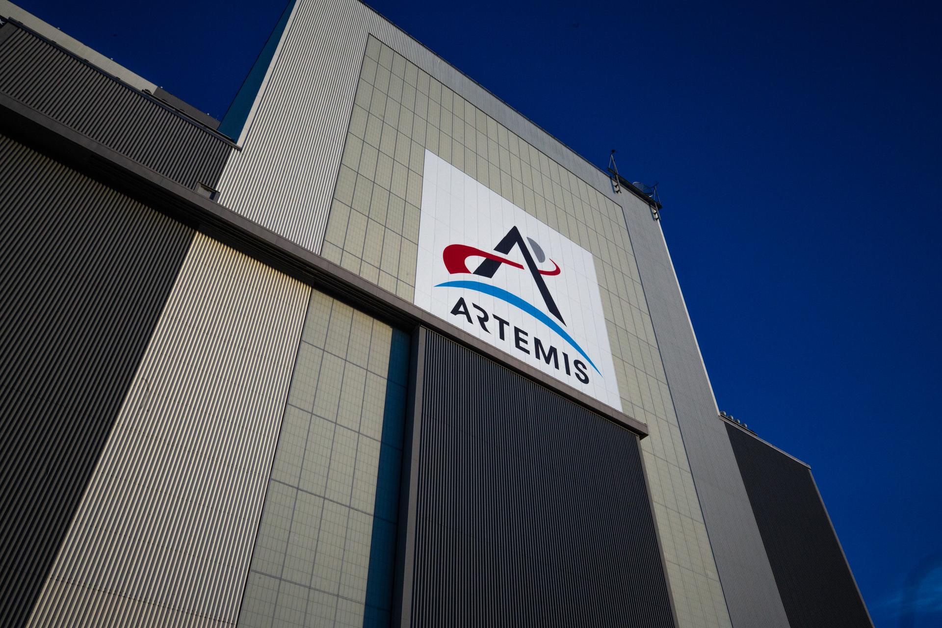 A view of the entrance to low bay of the Vehicle Assembly Building (VAB) at NASA’s Kennedy Space Center in Florida, during sunrise on Jan. 19, 2022 with the Artemis banner above the door.