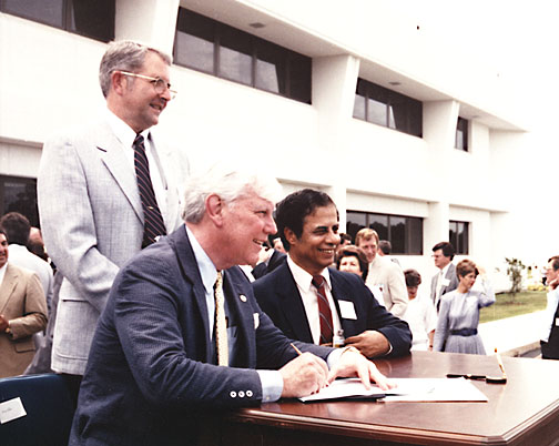 Standing is NASA Administrator Rear Adm. Richard Truly, and seated is Jerry Hlass, director of the Stennis Space Center.