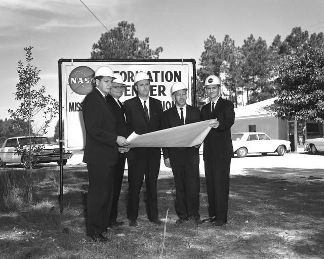 John Hillman (right) stands with NAA Officials at MTO (16 October 1963)