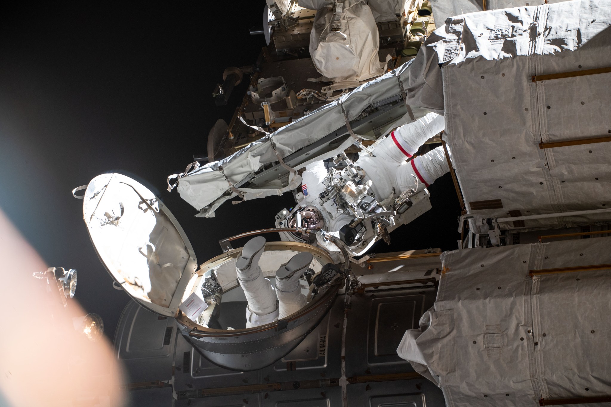 image of spacewalkers outside the space station