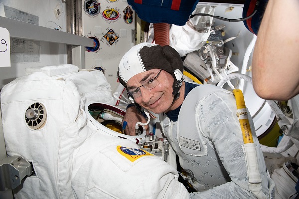 image of an astronaut suiting up for a spacewalk