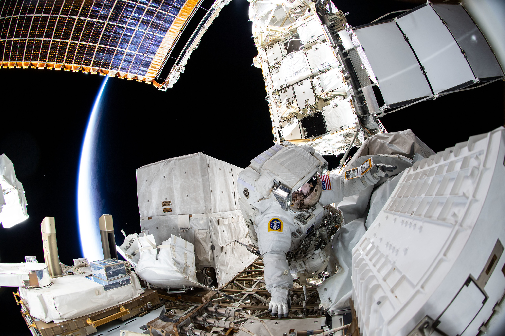 NASA spacewalker Kayla Barron is pictured during a six-hour and 32 minute spacewalk on Dec. 2, 2021, to replace a failed antenna system on the International Space Station's Port-1 truss structure.