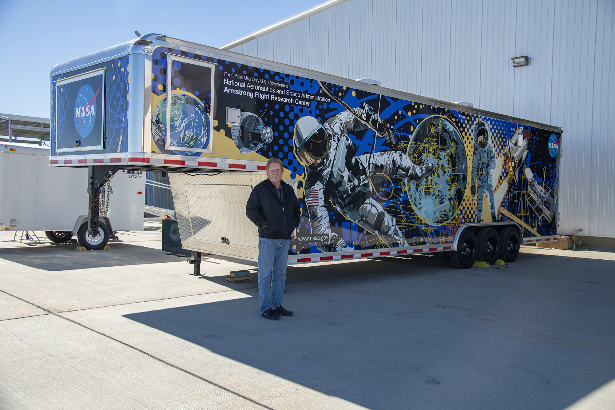 Alan Crocker in front of trailer.