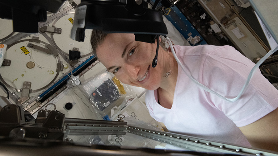 NASA astronaut Kayla Barron works inside the Life Science Glovebox conducting botany research for the Plant Habitat-05 investigation.