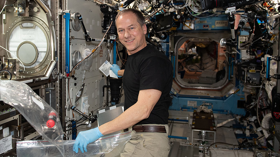 Astronaut Tom Marshburn wraps up a biology experiment that studied why microgravity accelerates skin aging in astronauts.