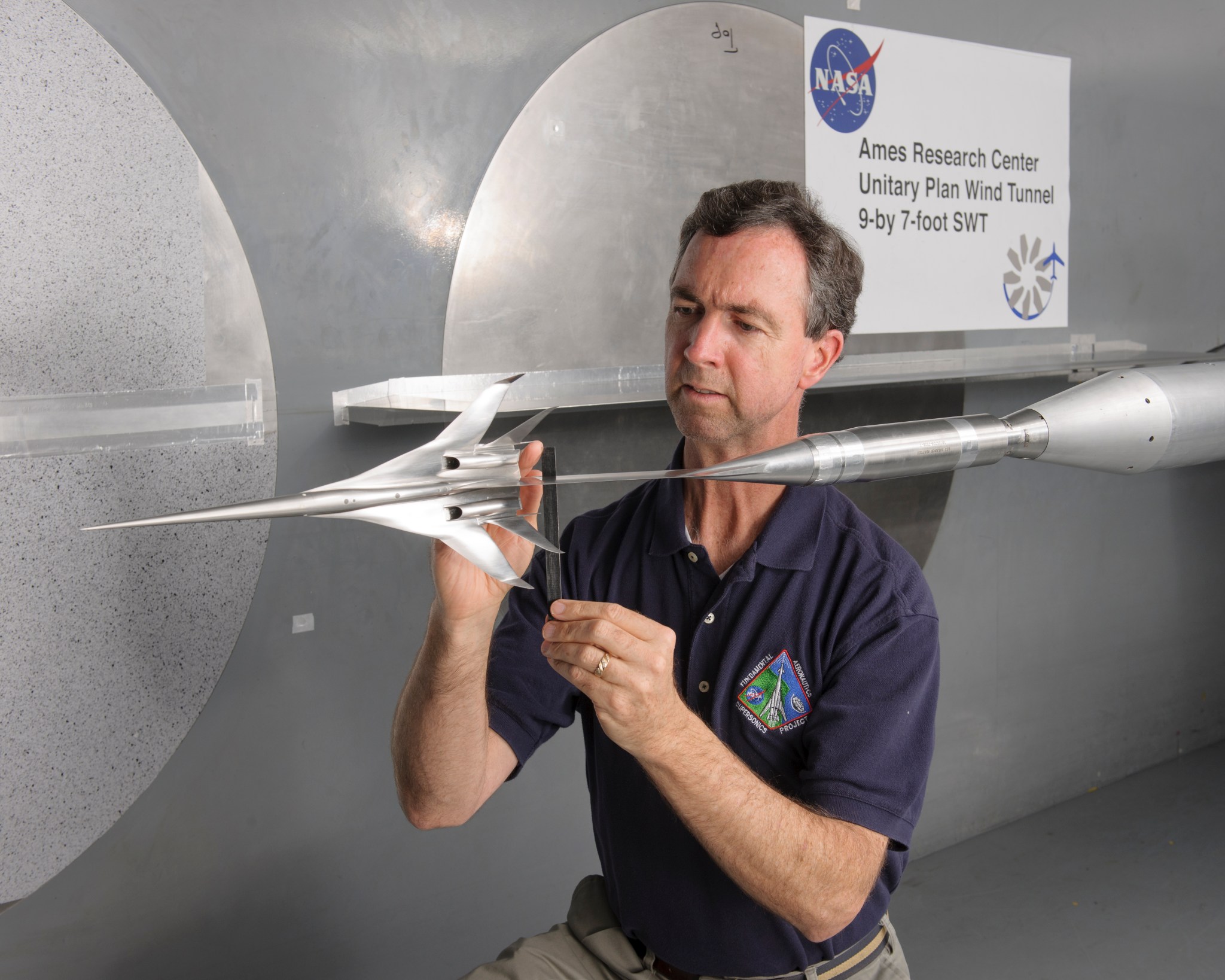Don Durston, an aerospace engineer with a model supersonic aircraft, ready for testing in the 9- by 11-foot Unitary Wind Tunnel at NASA’s Ames Research Center in California's Silicon Valley. 