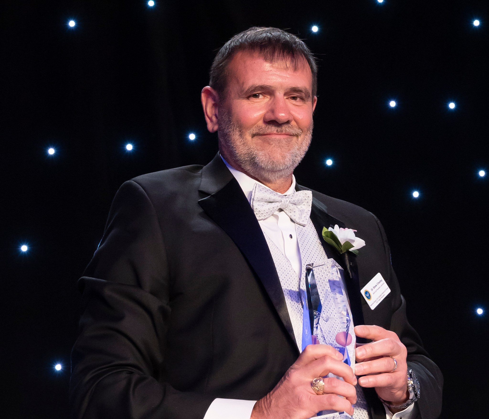 Steve Chesley, senior research scientist at JPL, receives the National Space Club’s Nelson P. Jackson Aerospace Award for Sentry-II on behalf of the Center for Near-Earth Object Studies at the club’s Goddard Memorial Awards Dinner on March 18, 2022. 