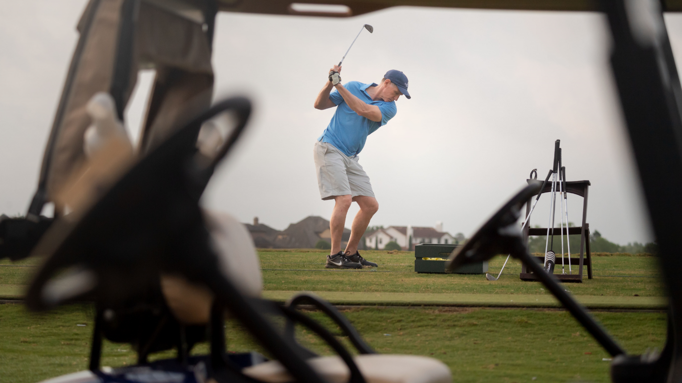 Golf player hitting ball