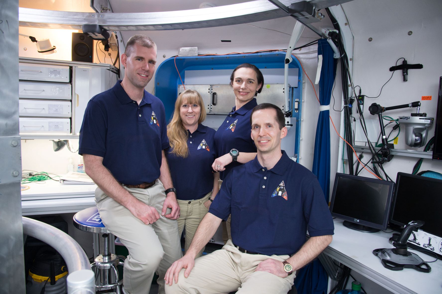 Andrzej Stewart (left) and his fellow crew members pose for a photo inside NASA's Human Exploration Research Analog, or HERA, in Houston. The crew lived and worked like astronauts during a two-week mission in 2015.