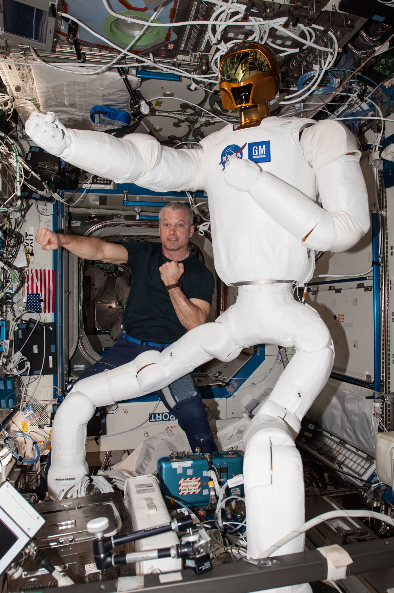 Photograph of Astronaut Steve Swanson,Expedition 40 Commander,taken with Robonaut after installation of the Robonaut legs. Robon