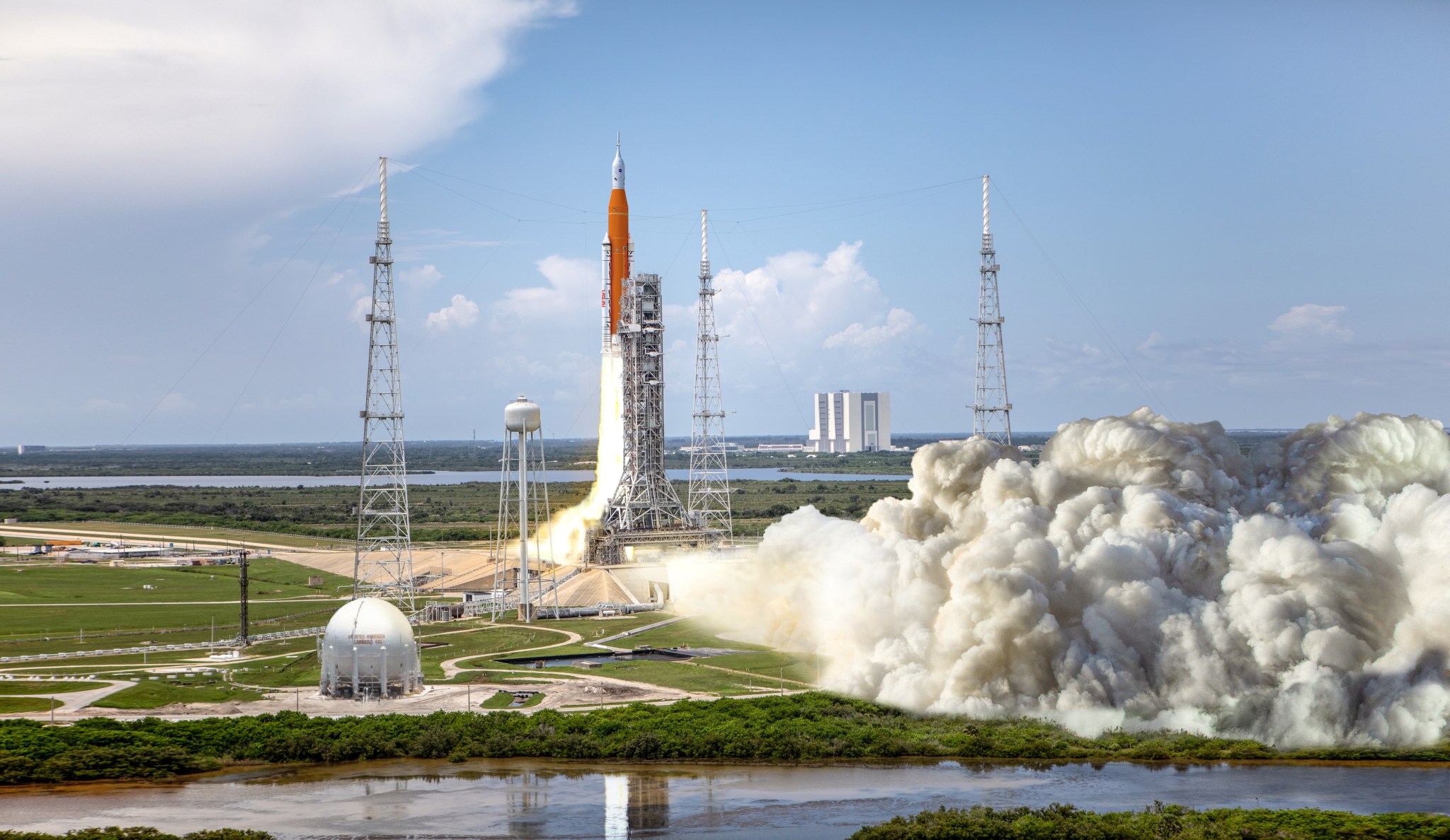 This artist rendering shows NASA’s Space Launch System (SLS) rocket and Orion spacecraft lifting off from Kennedy Space Center’s Launch Pad 39B for the Artemis I mission.