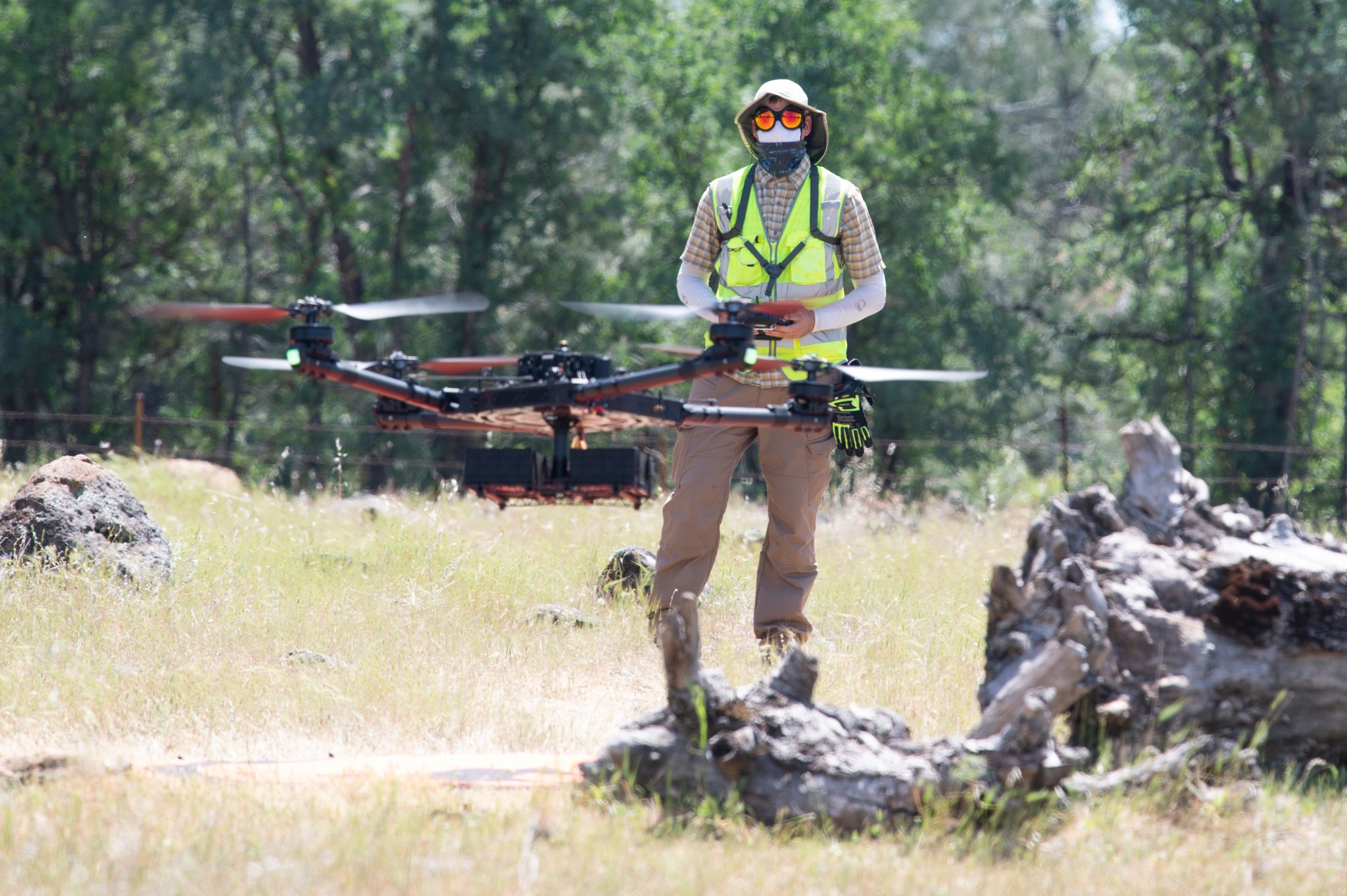 NASA drone pilot Jonas Jonsson flying a drone in a field.