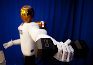 Robonaut2 holding a 20-pound weight