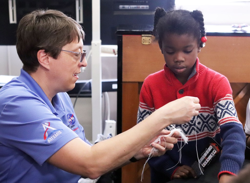 Michele Beisler, Deputy Program Manager for NASA’s Rocket Propulsion Test Program Office at NASA Stennis Space Center, shares a hands-on activity with a student during an outreach event at Obama Magnet Elementary School.