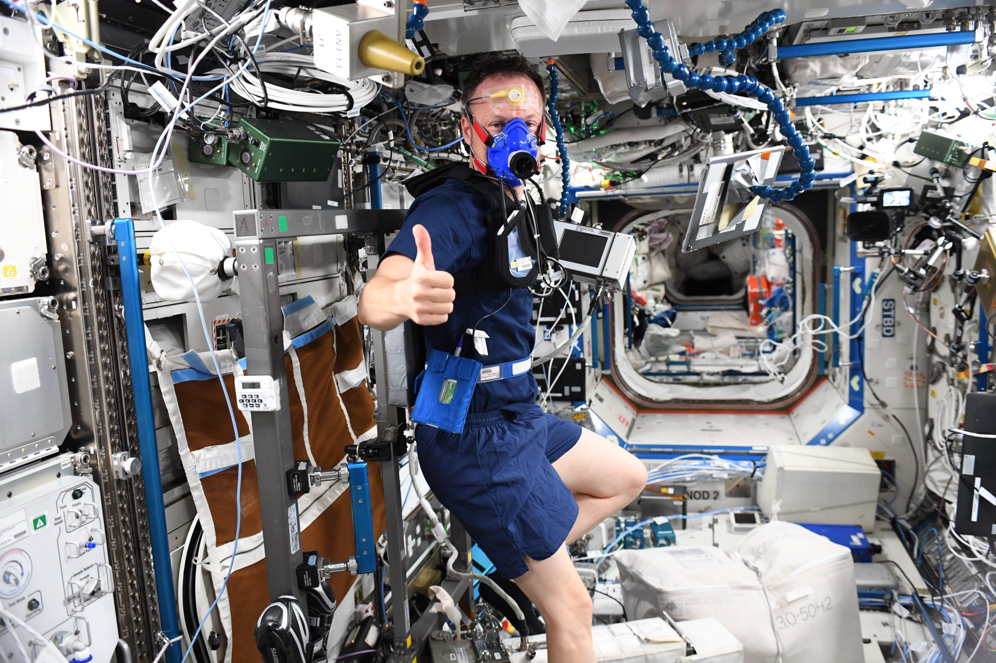 image of an astronaut on an exercise bike 