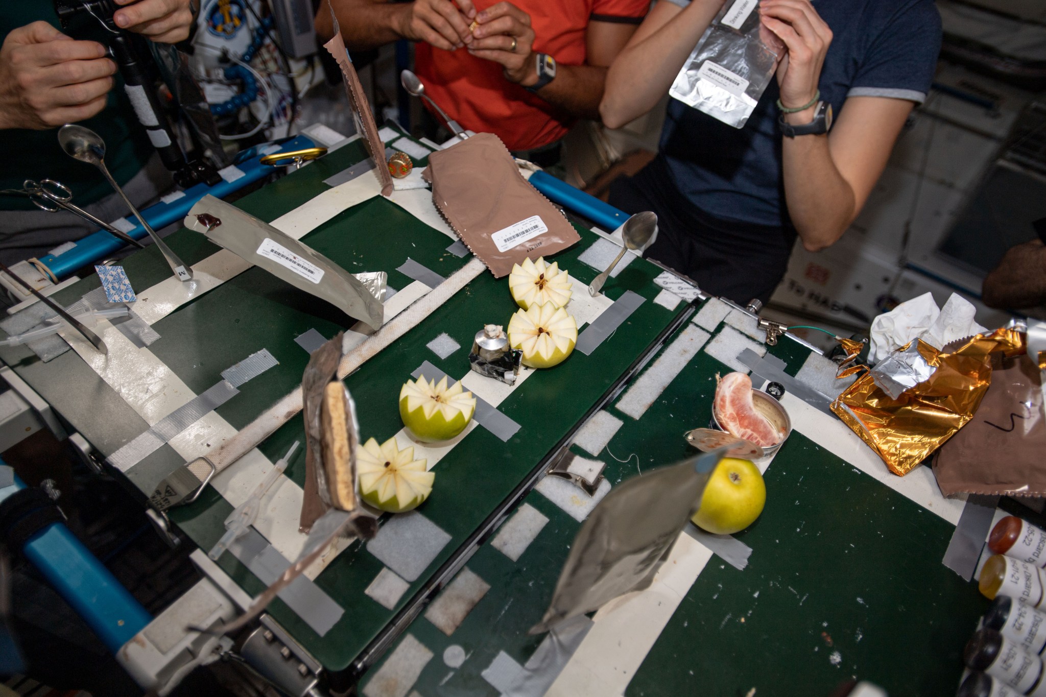 image of apples on the crew's meal table in station