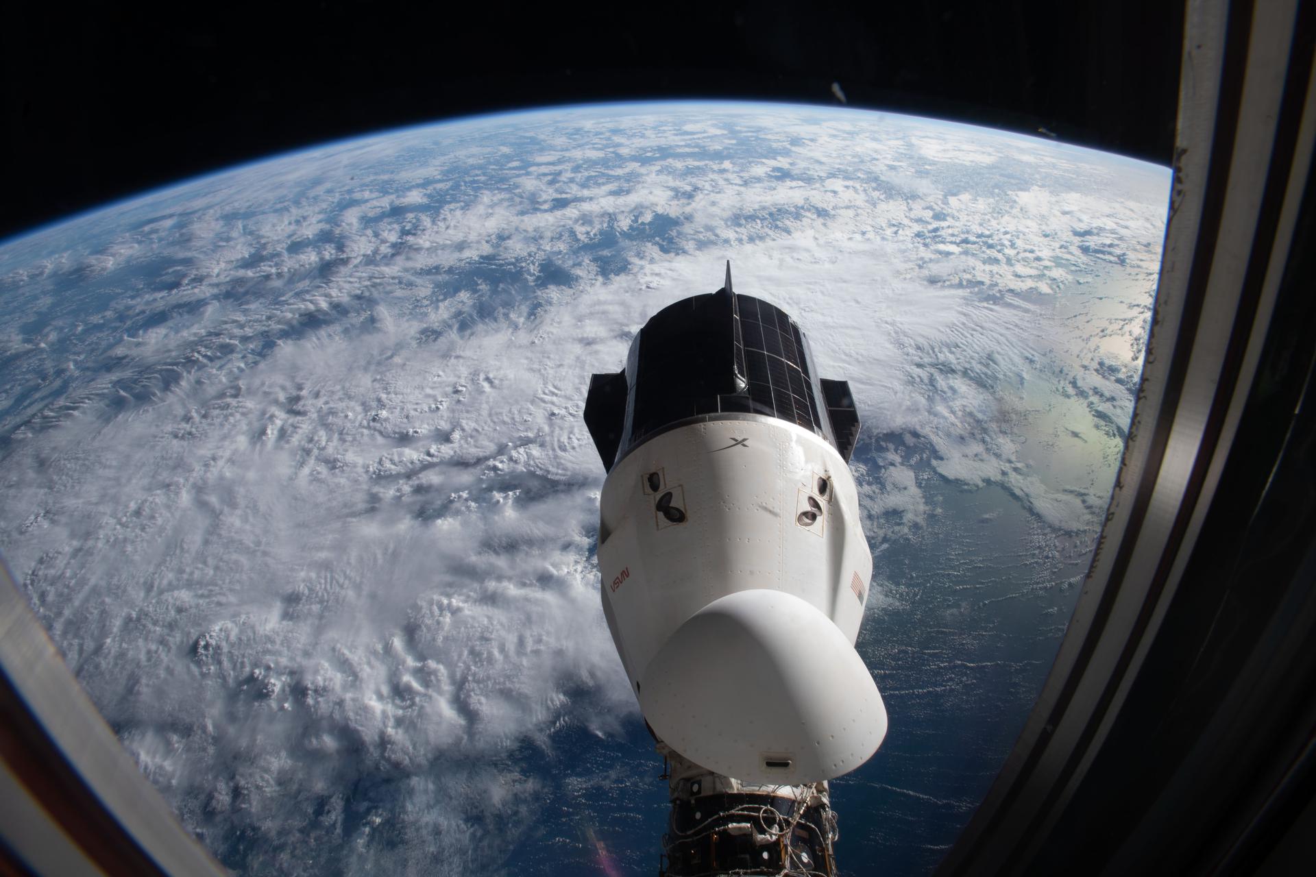 image of a capsule docked to the space station