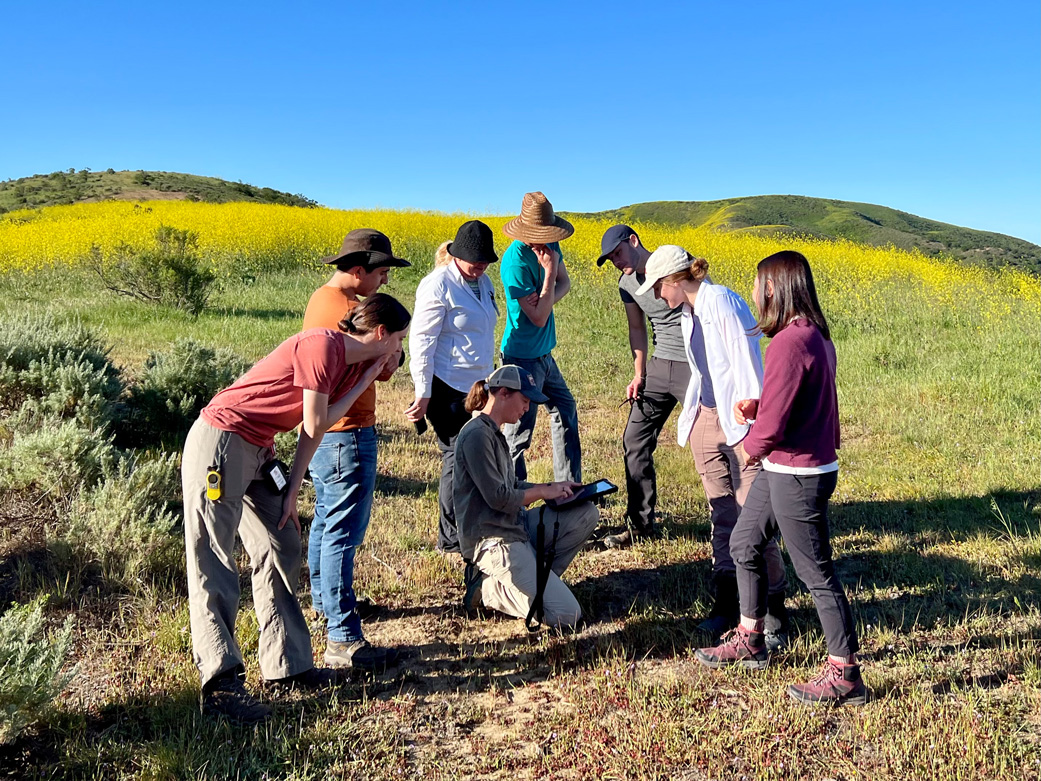 JPL scientist Dana Chadwick, center, advises a field team working on the SHIFT campaign on locations for collection and analysis of vegetation samples at the Jack and Laura Dangermond Preserve in March 2022.
