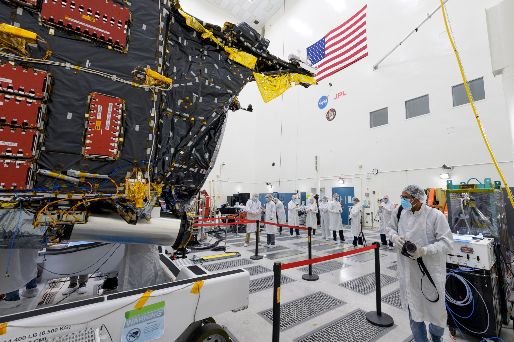 Members of the media view the Psyche spacecraft on April 11, 2022, inside a clean room at JPL.
