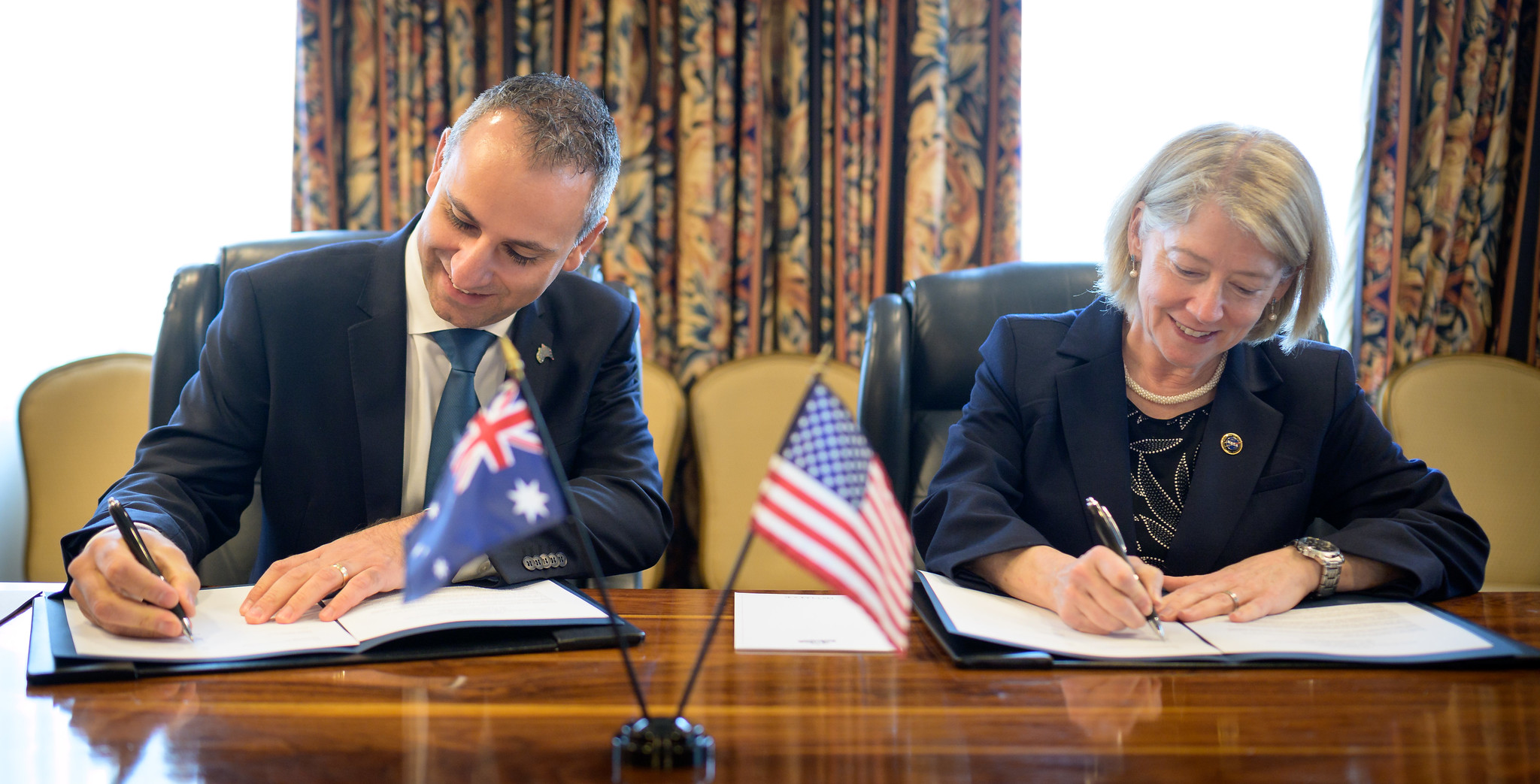 Australian Space Agency Head Enrico Palermo, left, and NASA Deputy Administrator Pam Melroy, sign a joint statement of intent for cooperation in Earth science during the 37th Space Symposium, Monday, April 4, 2022, in Colorado Springs, Colorado.