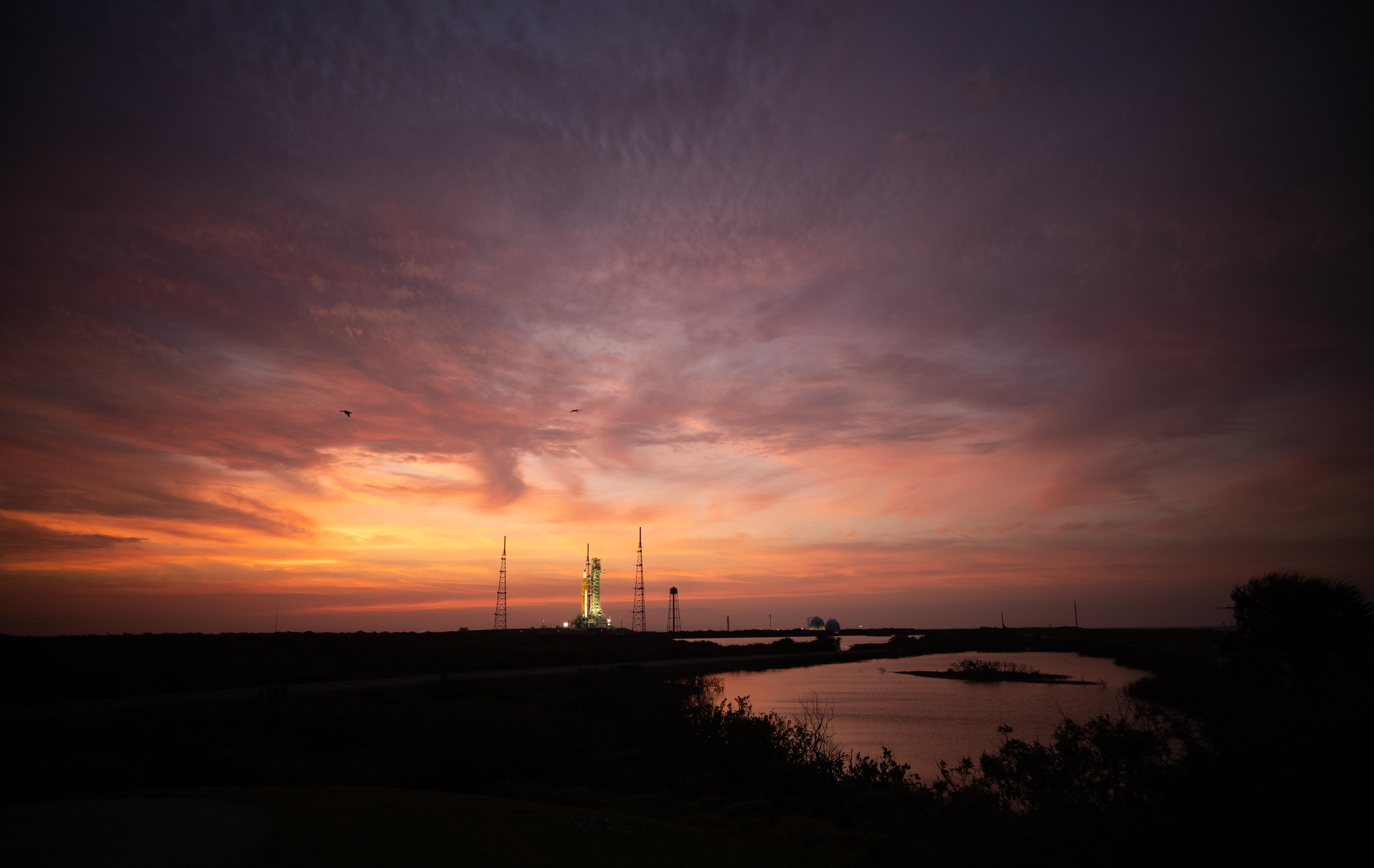 NASA’s Space Launch System (SLS) rocket with the Orion spacecraft aboard is seen atop a mobile launcher at Launch Complex 39B, Thursday, April 7, 2022.