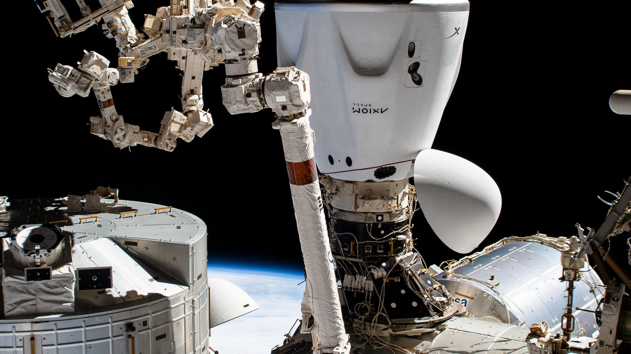 The SpaceX Dragon Endeavour crew ship is pictured docked to the Harmony module's space-facing international docking adapter.