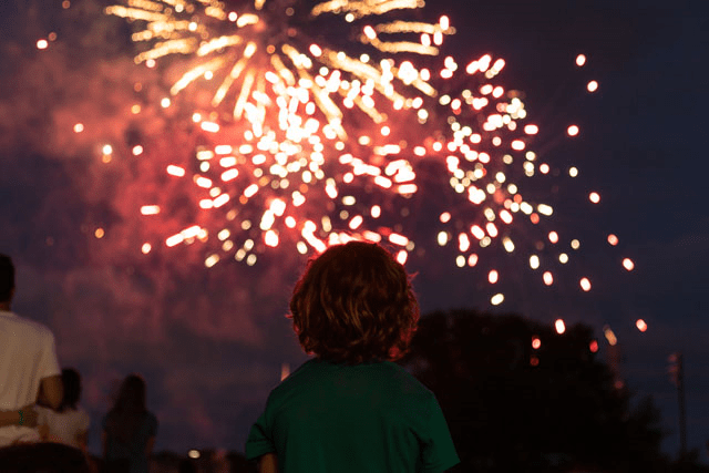 child looking at fireworks