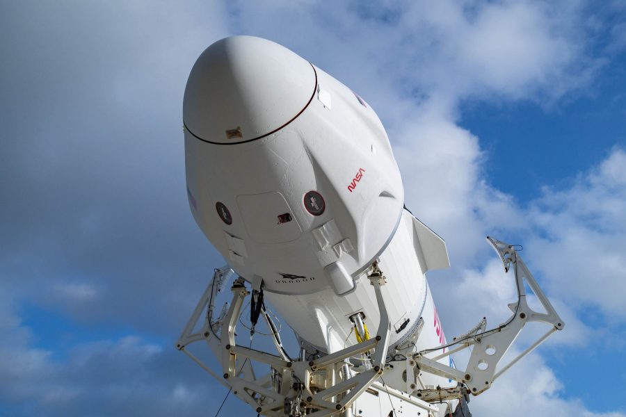 The SpaceX Falcon 9 and Dragon spacecraft that will launch NASA's Crew-4 astronauts are mated prior rolling out of the hangar at Kennedy Space Center's Launch Complex 39A.