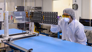 Engineer working on Starling satellite.