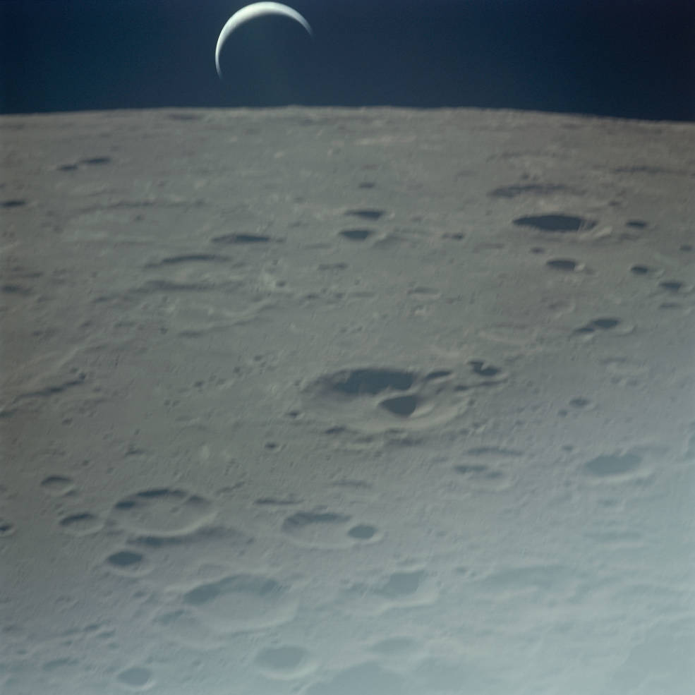 apollo_16_return_to_earth_chang_heng_crater_and_crescent_earth_post_tli