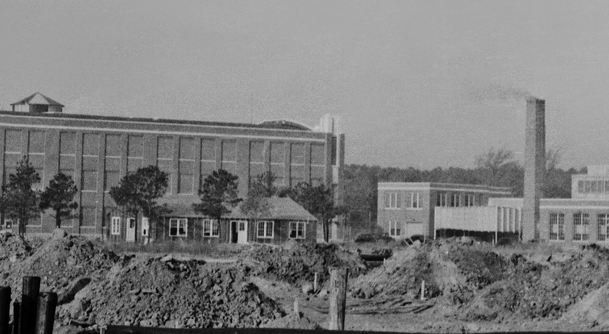 The original West Area cafeteria, Building 1227, can be seen in the foreground adjacent to the large Building 1148 in this 1941 photograph.