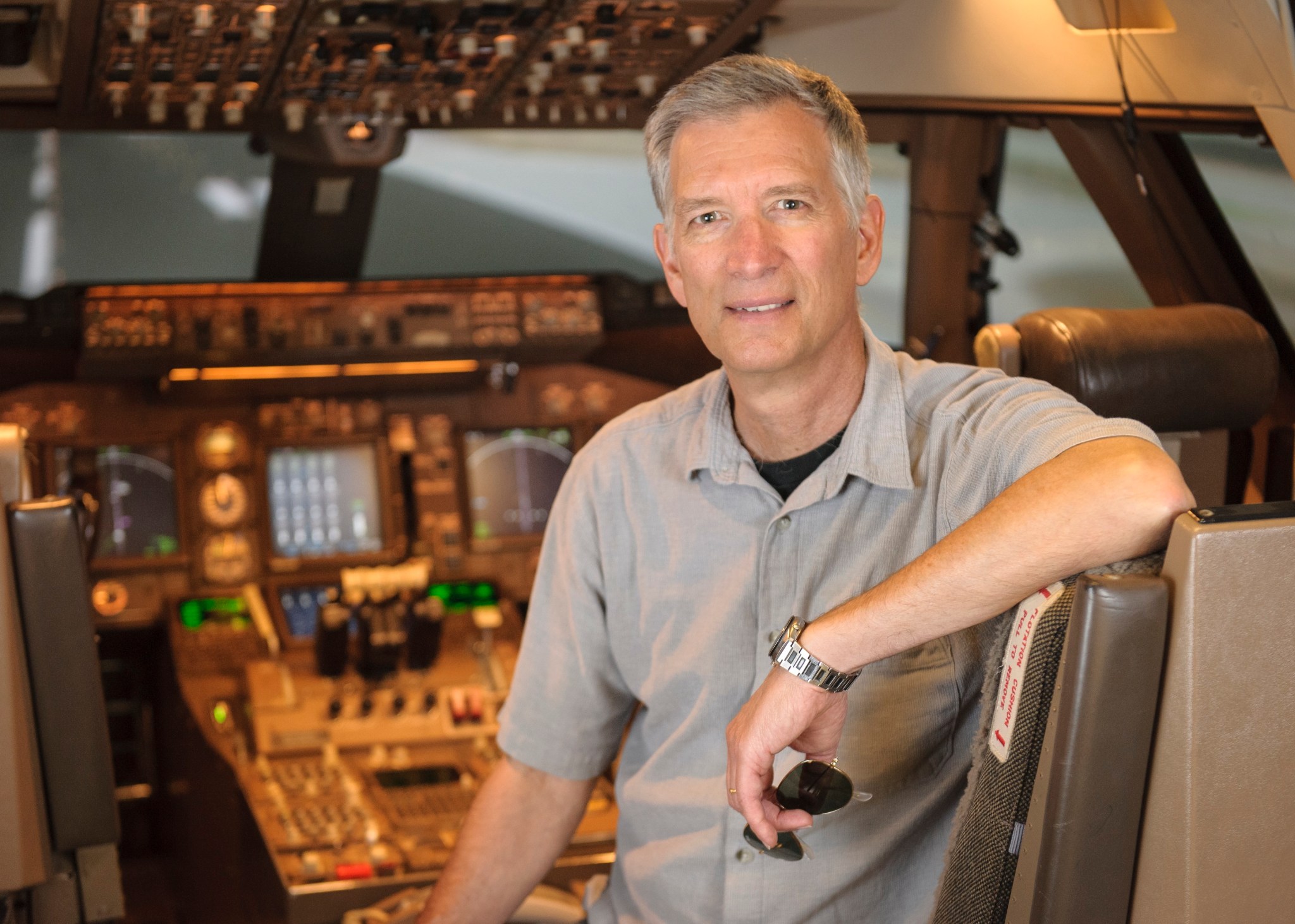 Photo of Immanuel Barshi, ARMD's System-Wide Safety Project research psychologist, sitting inside an airplane's cockpit.