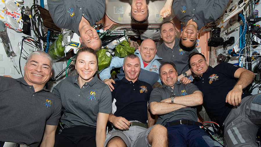 The ten-member Expedition 66 crew poses for a portrait aboard the International Space Station in March of 2022.