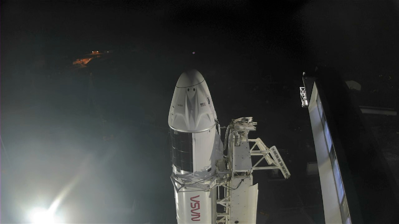 SpaceX’s Falcon 9 rocket with the Crew Dragon atop is seen at Kennedy Space Center’s Launch Complex 39A on April 26, 2022, as the crew access arm retracts ahead of the agency’s SpaceX Crew-4 launch.