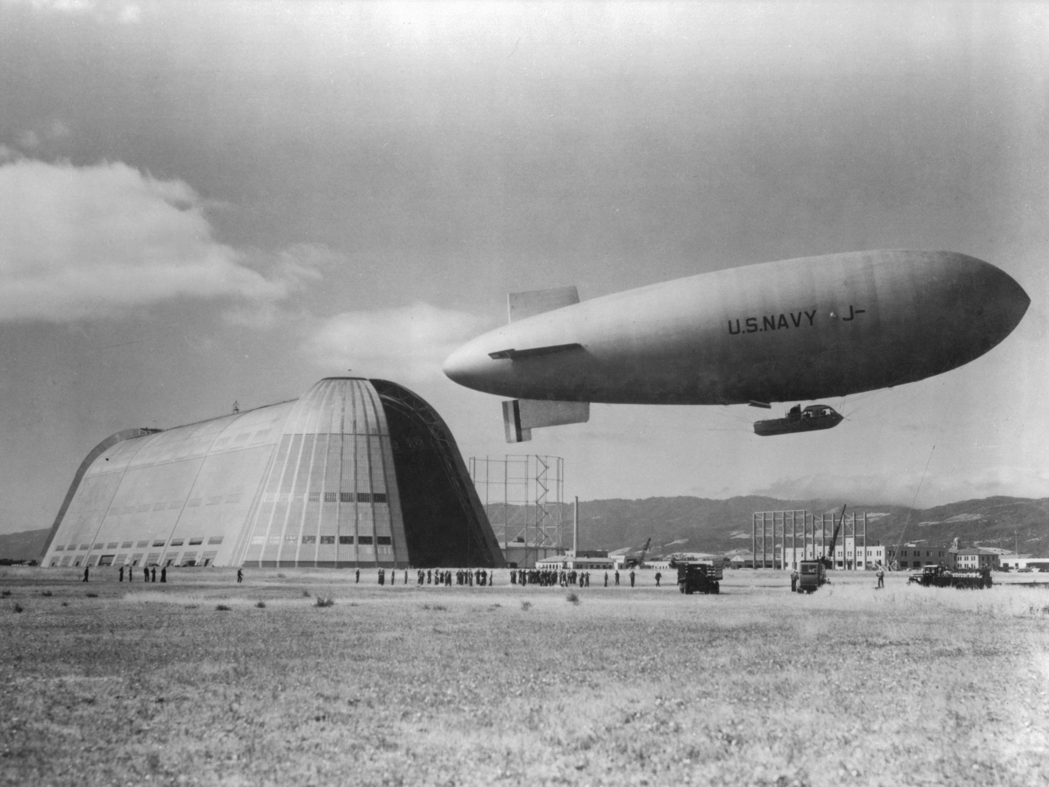 U.S. Navy J-4 airship with Hangar One, circa 1934. 