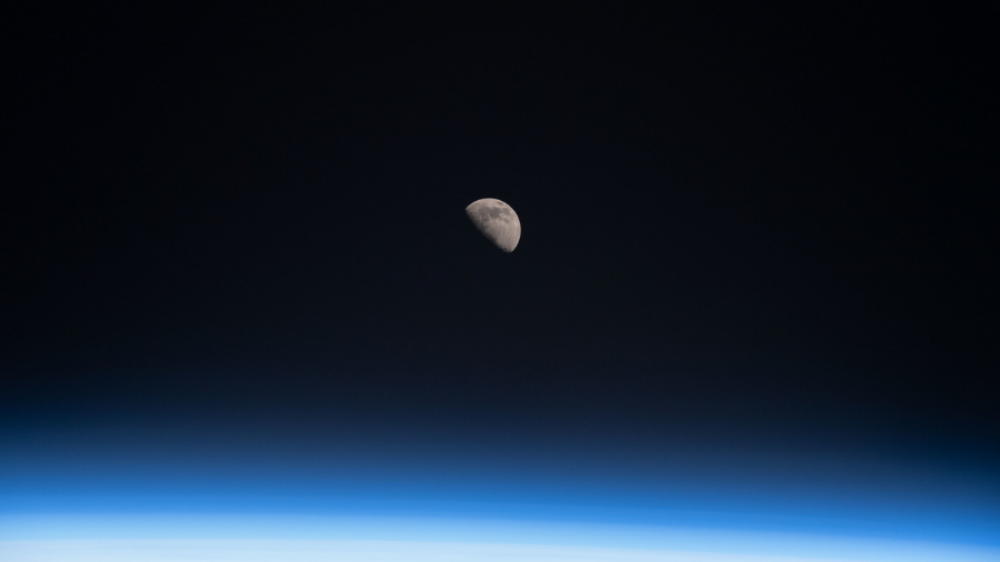 The full quarter Moon is pictured from the International Space Station as it orbited 261 miles above the Gulf of Mexico off the coast of Pensacola, Florida on April 9, 2022.
