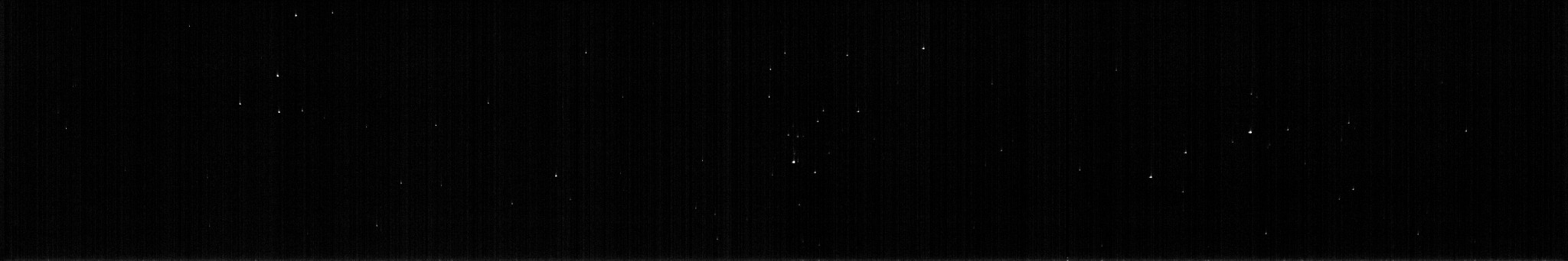 Panorama-like black-and-white image, mostly black with a smattering of dim white stars. of stars