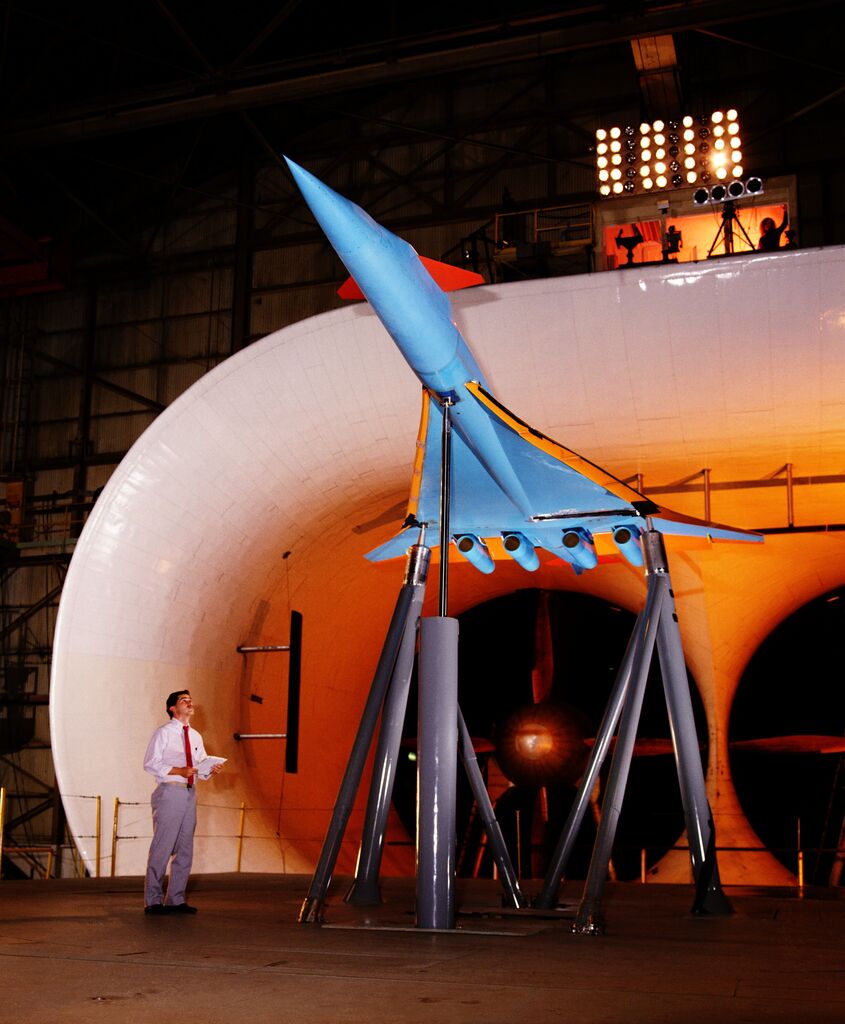 Engineer Dave Hahne inspects a 1/10th scale model of the MACH 2.2 supersonic transport concept, designed by the Douglas Aircraft Company, in the Full-Scale Tunnel.
