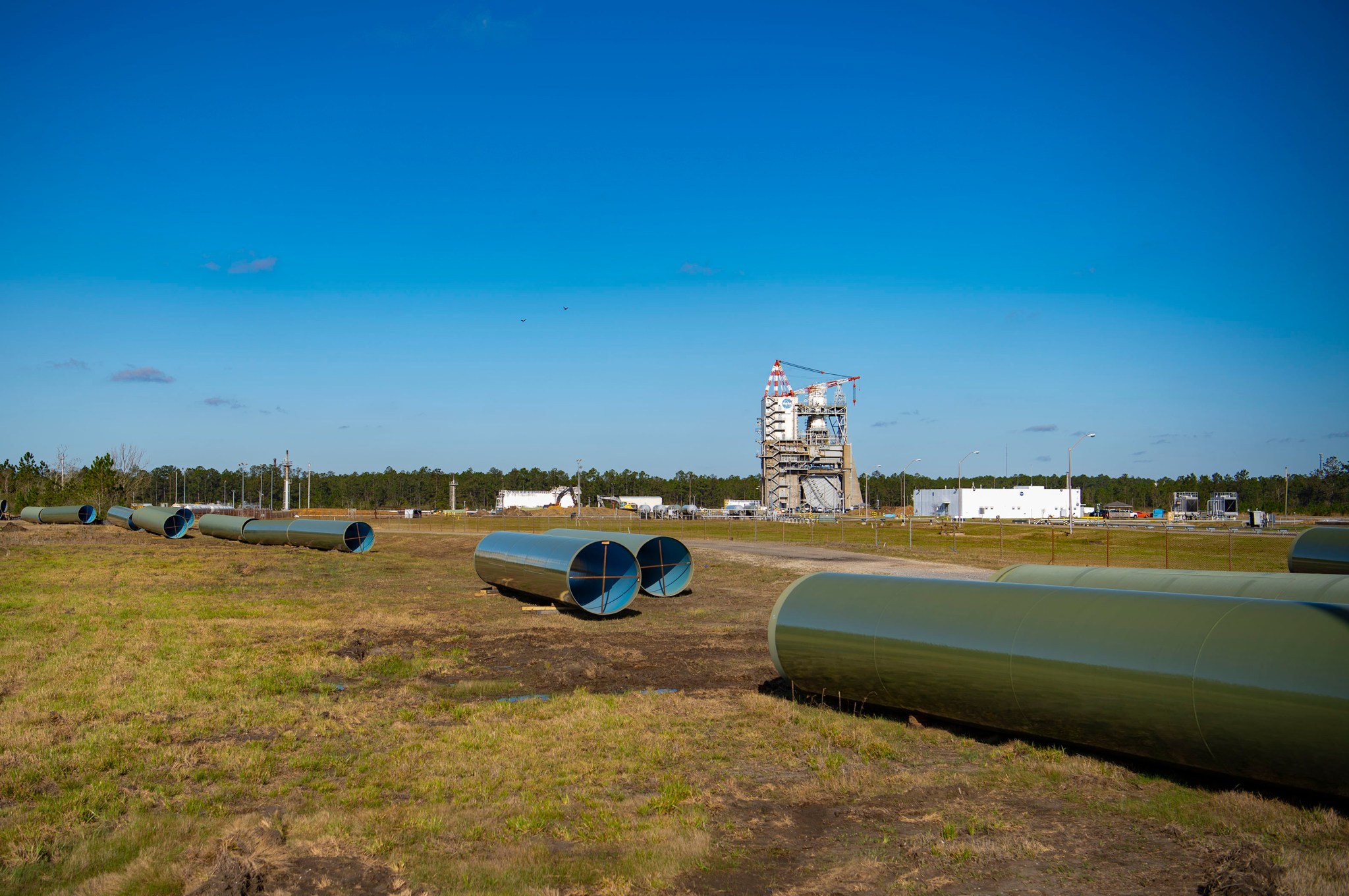 Sections of new 75-inch pipe await installation between Stennis Space Center’s High Pressure Industrial Water Facility and the valve vault pit serving the Fred Haise Test Stand