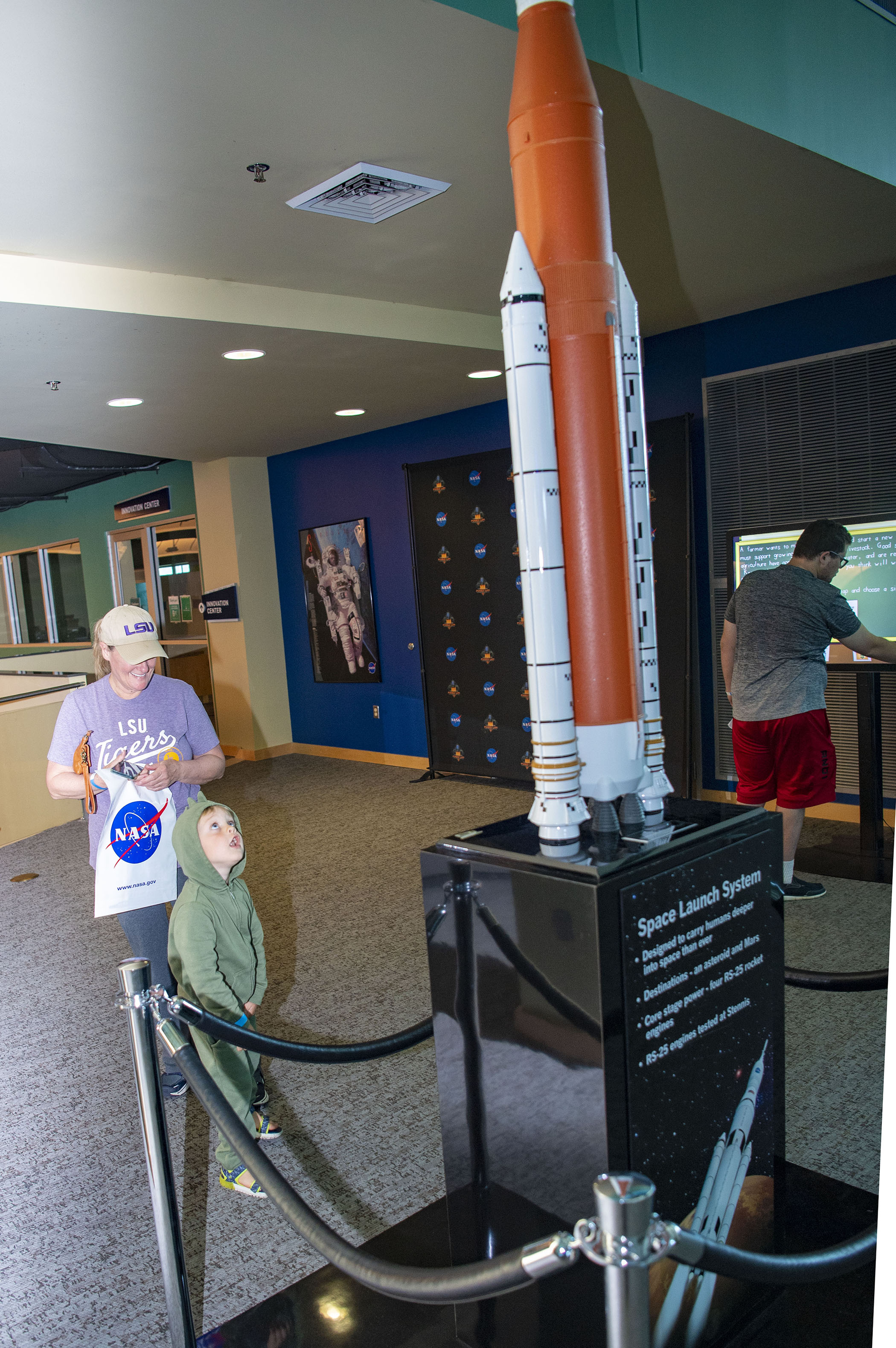 A young visitor views a model of NASA’s new Space Launch System rocket, being built to send astronauts on deep space missions to the Moon and Mars, at INFINITY Science Center.