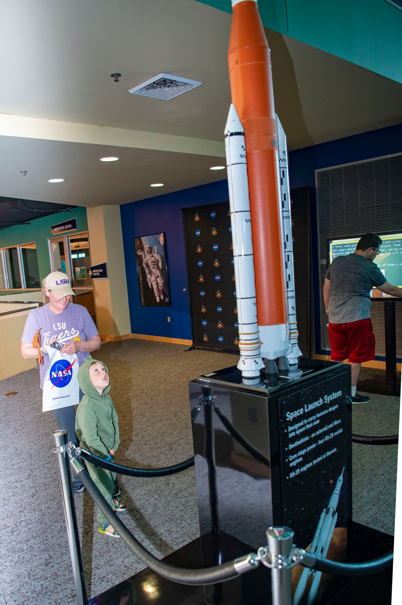 A young visitor views a model of NASA’s new Space Launch System rocket, being built to send astronauts on deep space missions to the Moon and Mars, at INFINITY Science Center. 